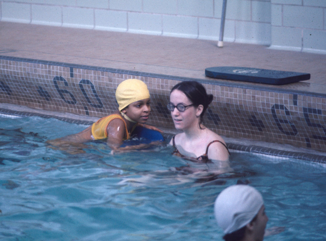 people swimming in a pool