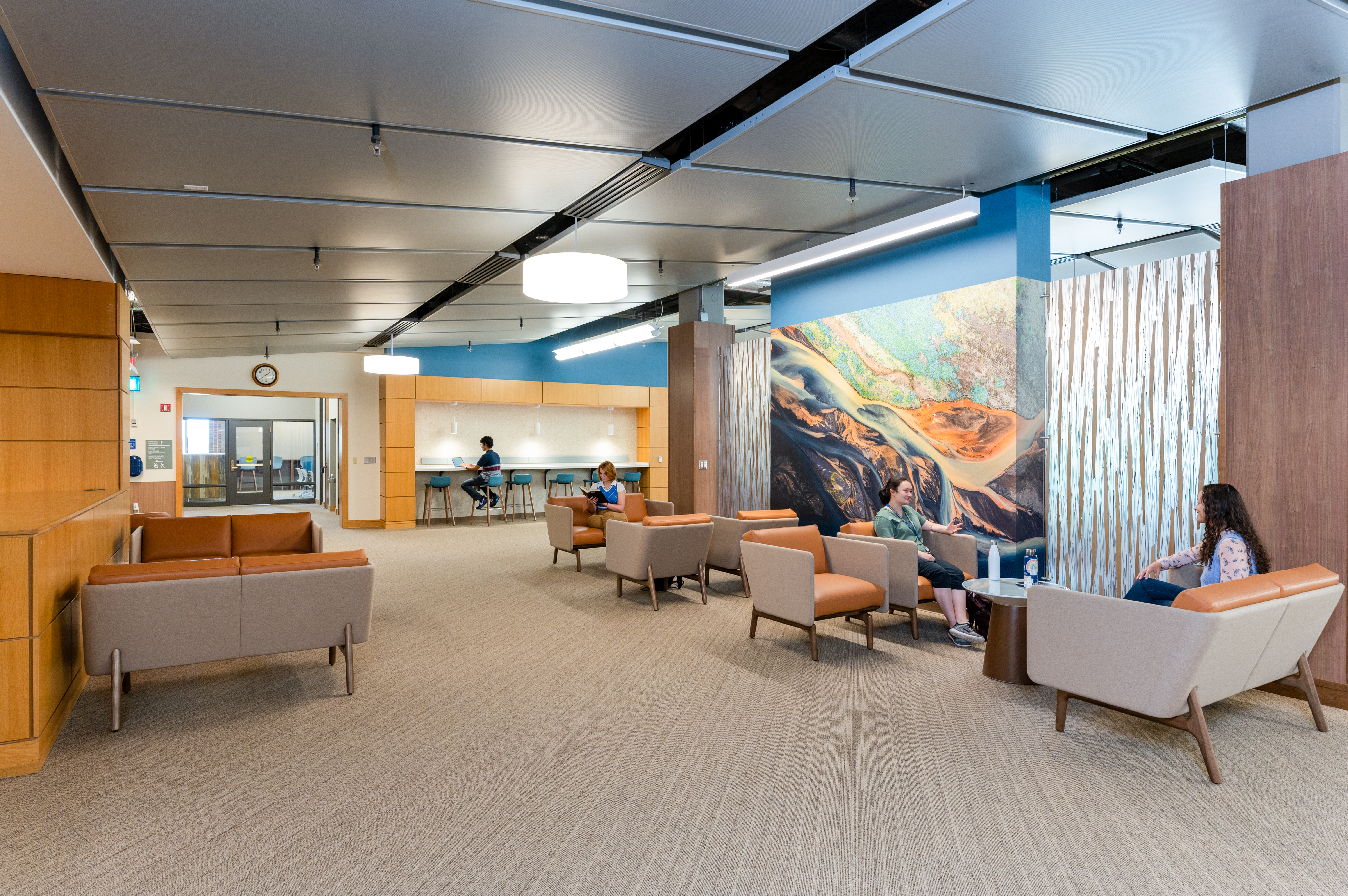 Photo of Gleason Library's mural at the meeting point at the top of the stairs