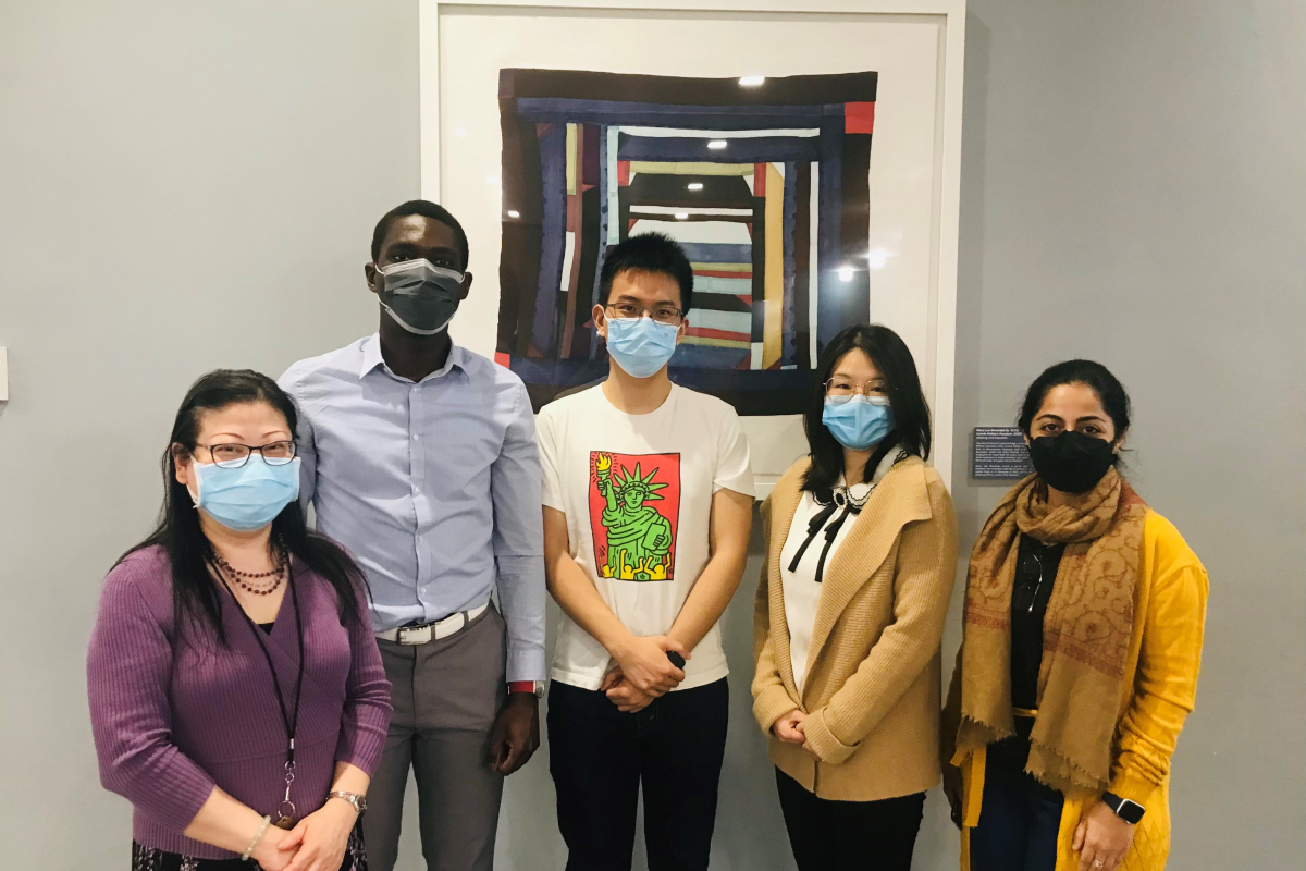 Librarians Kathy Wu and Sarah Siddiqui standing with data grant winners Jean-Joel Legre, Lipeng Chen, and Ruqui Wu in Lam Square