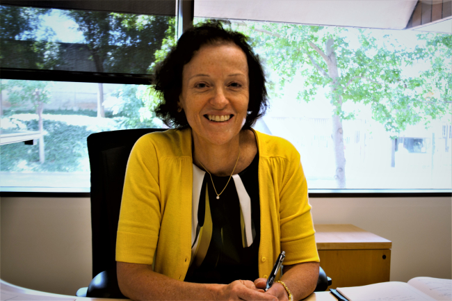 Barbara Burger sitting at a desk