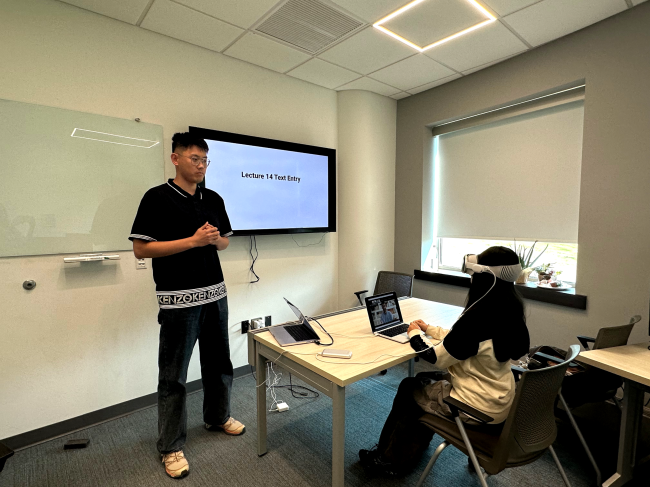 Professor Yukang Yan runs an experiment using the Apple Vision Pro. 