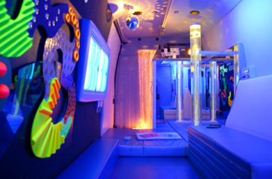 A room filled with multicolored lights and other sensory equipment.