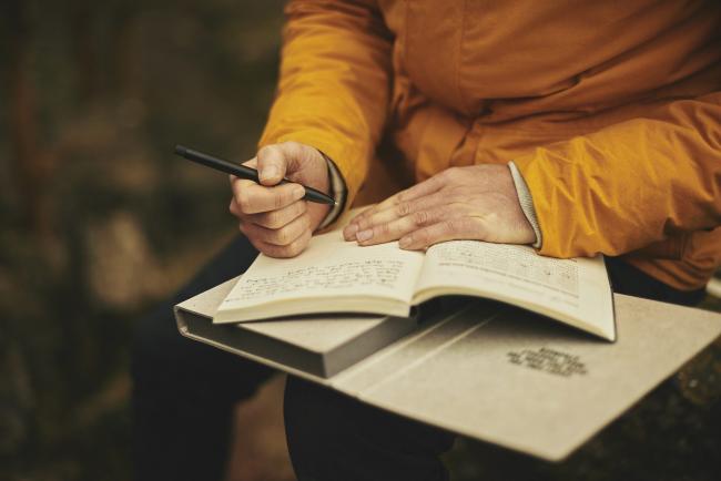 Person writing in a journal