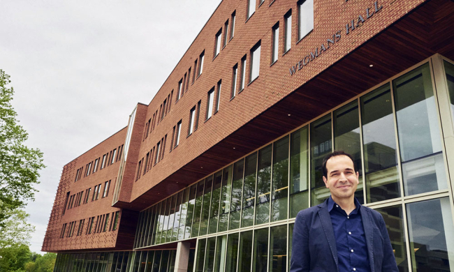 Professor Mujdat Cetin standing in front of Wegmans Hall.