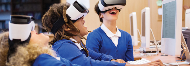 children wearing vr headsets.