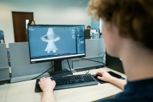 student working on his model. 