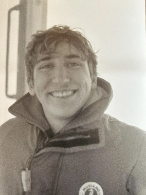 Boshi in black and white smiling at camera