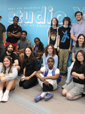 A group of people including staff and students posing for a group photo.