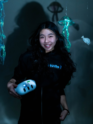 Hyeji Holding headset smiling