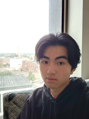 Daniel Lin next to window