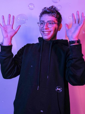 caleb with bubbles smiling